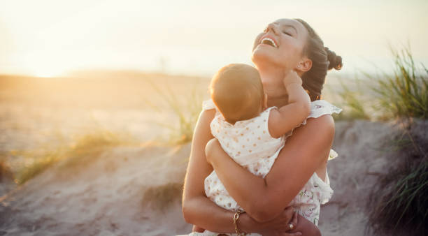 happy mother with her newborn baby stock photo