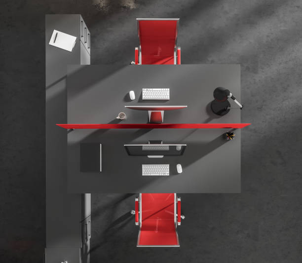 istock Top view on dark office interior with desk with desktop 1391257035