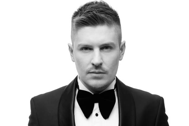 istock Confident attractive young man in black tuxedo 1391257811