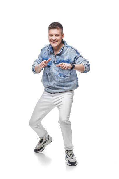 istock handsome young man in denim jacket with fist up 1391258064