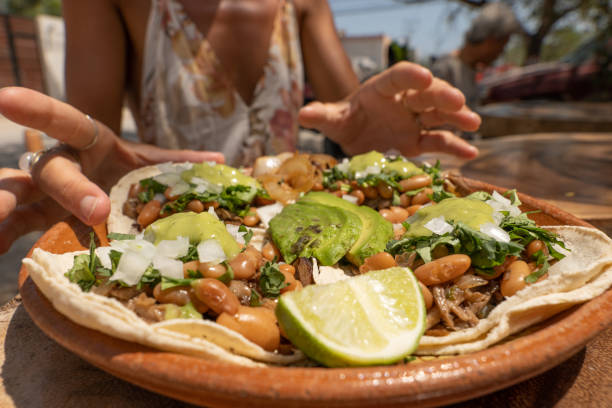 istock Having a plate of Mexican tacos 1391258102