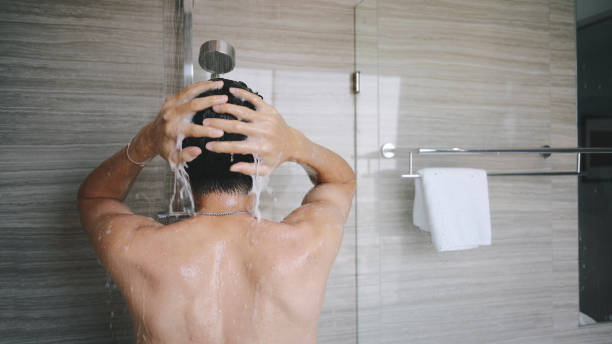 istock Rear View Of A man taking a shower 1391259291