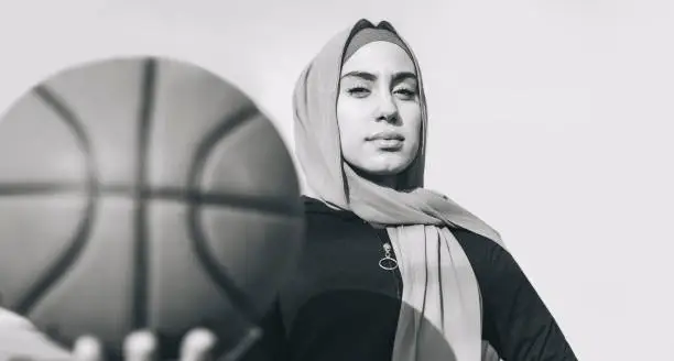 Photo of Beautiful young muslim basketball player - black and white edition -