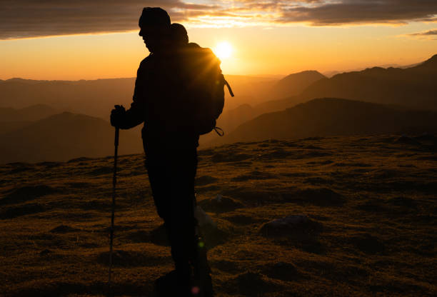 istock Silhouette Of A Rock Climber On The Peak 1391261815