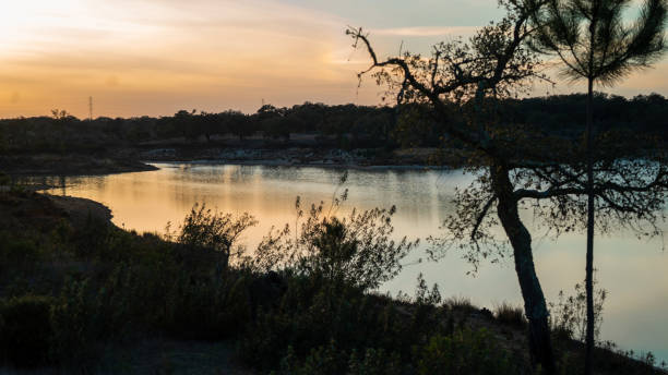 istock lake - sky - water - summer - sun - tree - sunset - clouds 1391262141