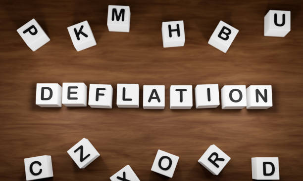 istock Deflation, price cut and low demand. White dice with dark capital letters on a table. 1391262171