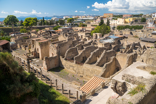 A wide-angle view of ruins in the ancient town of Herculaneum, which was buried in lava during the eruption of Mount Vesuvius in Italy in 79 AD.