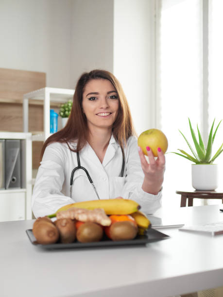 istock young female nutritionist in office 1391263554