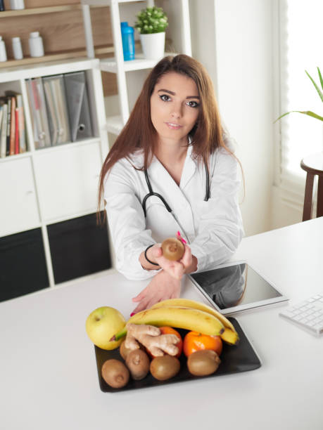 istock young female nutritionist in office 1391263593