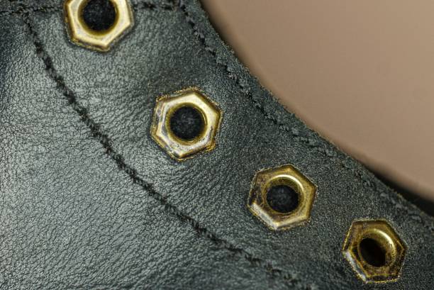 istock black leather texture with metallic yellow rivets on old shoes 1391263833