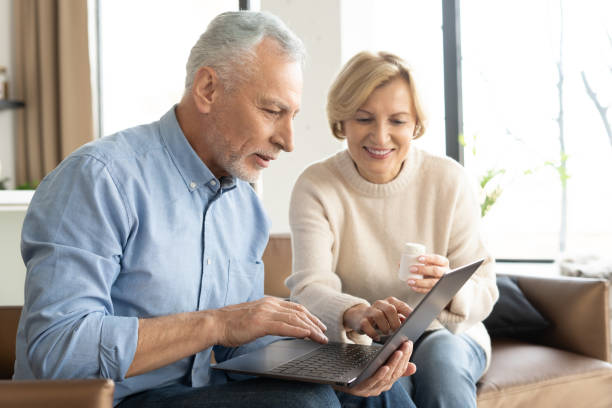 istock Married couple using laptop, buying medication online 1391264729