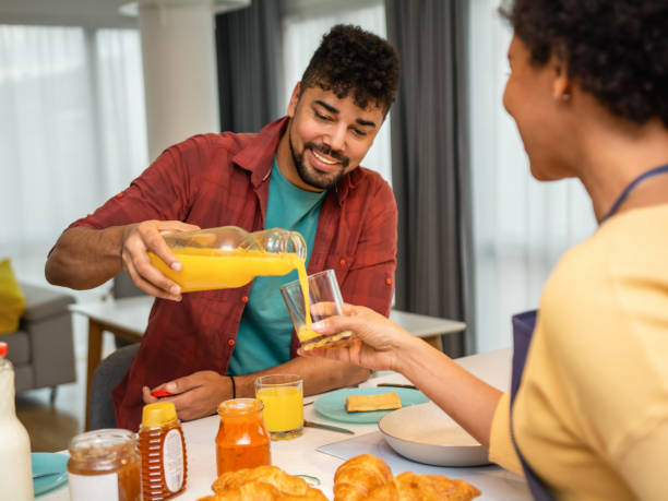 istock Happy black couple having breakfast in the kitchen 1391269370