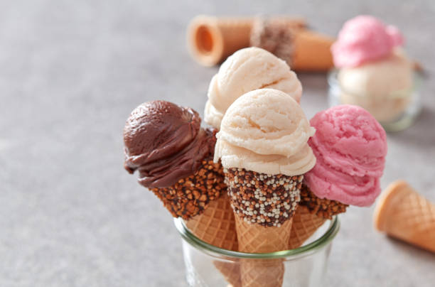 istock Strawberry, vanilla and chocolate ice cream cones 1391270682
