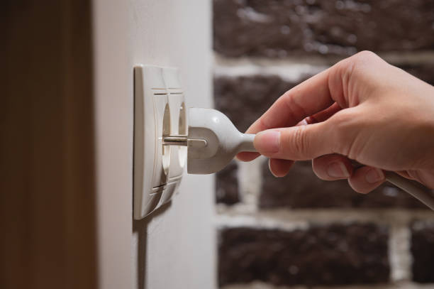 istock A female hand inserts white electric plug into a euro-format socket close-up 1391271021