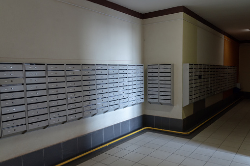 a lot of mailboxes in entrance hall of residental building. High quality photo