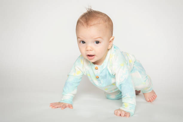 istock Seven Month Old Baby Boy Learning to Crawl 1391274312
