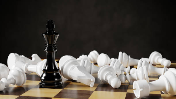 istock Black chess king among lying white pawns on a chessboard. 3D rendering illustration. 1391274405