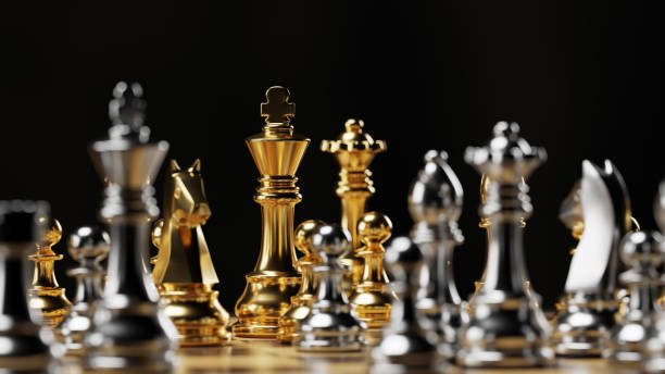 istock Gold and silver chess figures placed on chessboard. 3D rendering illustration. 1391274493
