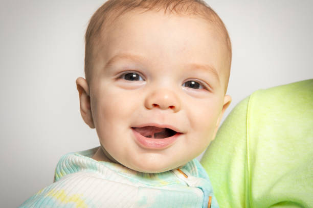 feliz bebé de siete meses - studio shot mouth open horizontal head and shoulders fotografías e imágenes de stock