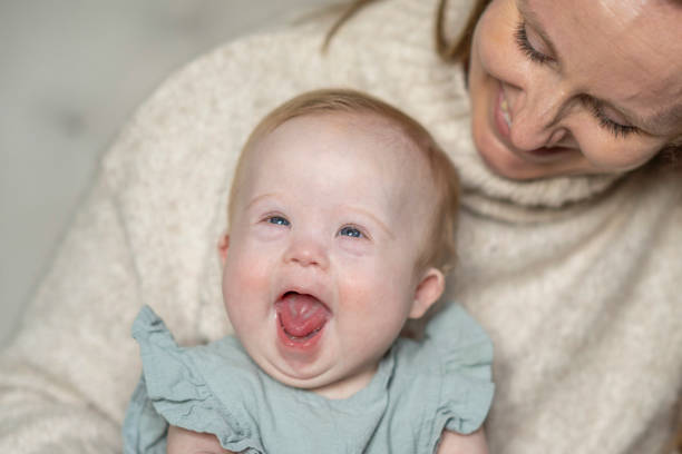 istock Baby with Down Syndrome and Her Mother 1391274543