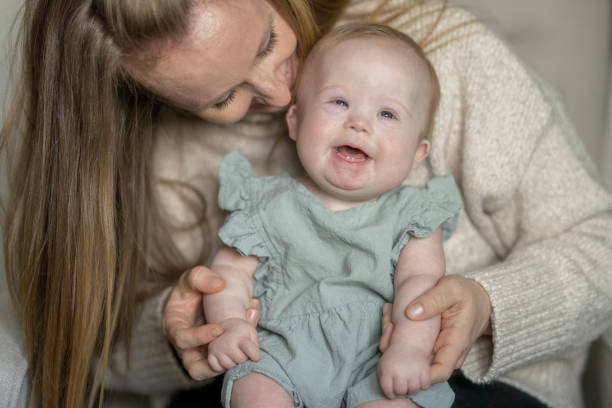 istock Baby with Down Syndrome and Her Mother 1391274556