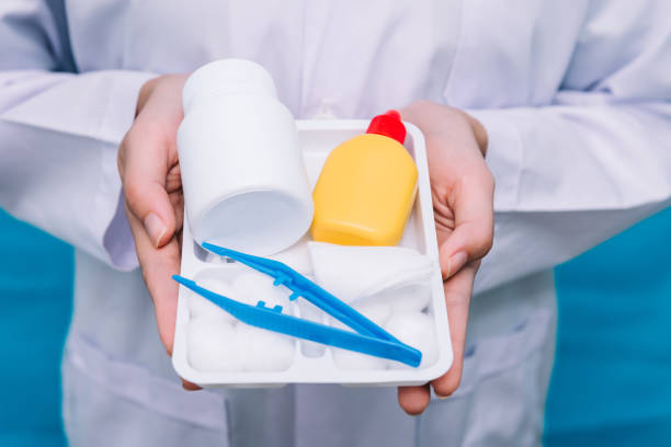 Close up doctor holding first aid box kit in hand.