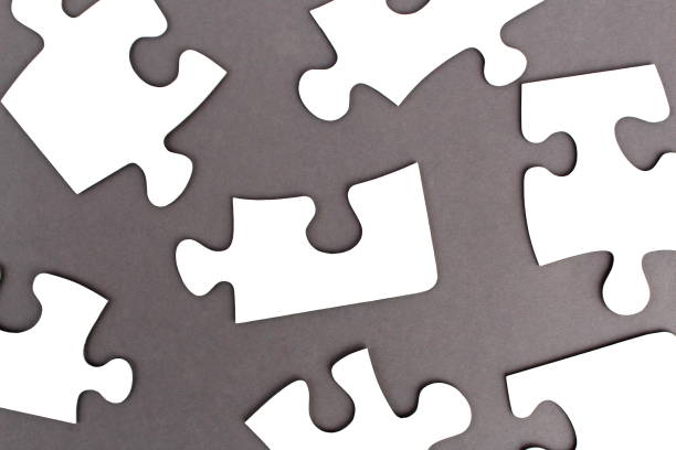istock Abstract texture white puzzles scattered on gray background 1391278613