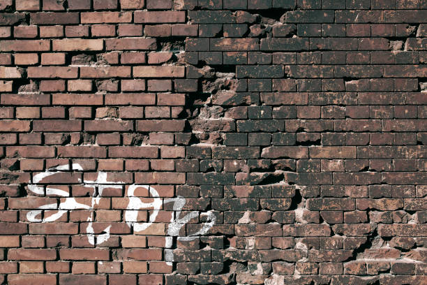 istock Texture of a brick wall with an inscription 1391279474