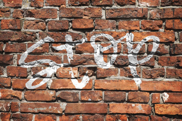 istock Texture of a brick wall with an inscription 1391279478