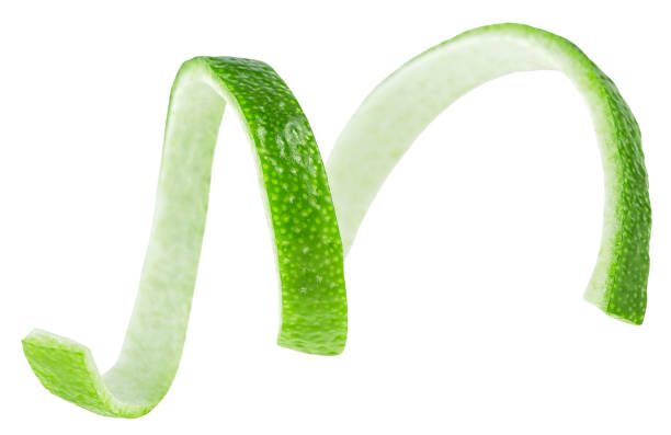 istock Green lime twist isolated on a white background. Lime skin or lime zest. 1391280362
