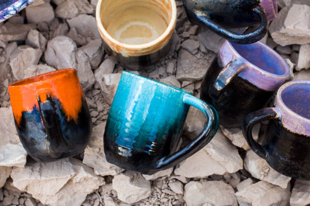 istock Handmade clay cups lying on the stones 1391281886