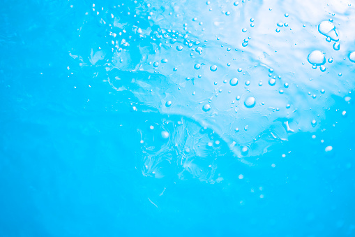 3D Illustration.Multiple round liquids, water in blue sky. Background material. (horizontal)