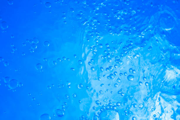 colpi d'acqua materici - green sea whirlpool bubble foto e immagini stock