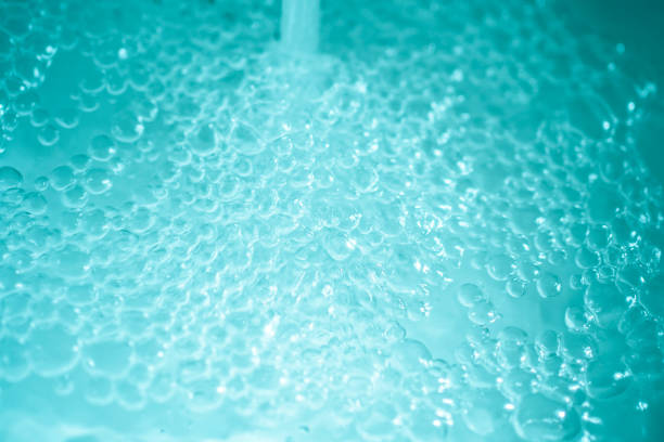 scatti d'acqua texturali - green sea whirlpool bubble foto e immagini stock