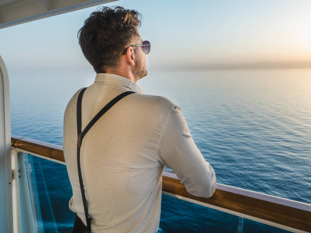 istock Fashionable man standing on the empty deck 1391286440