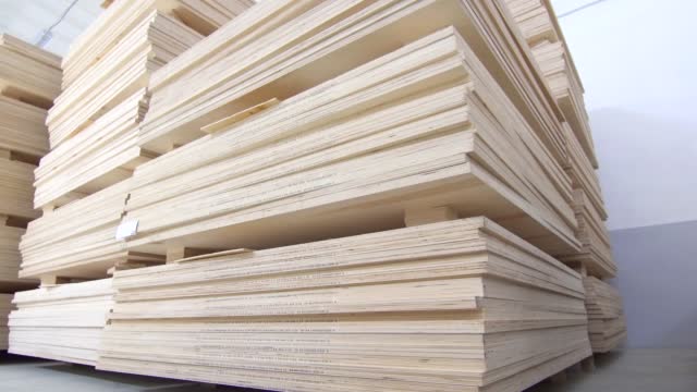 plywood in stock dolly shot ,commercial warehouse