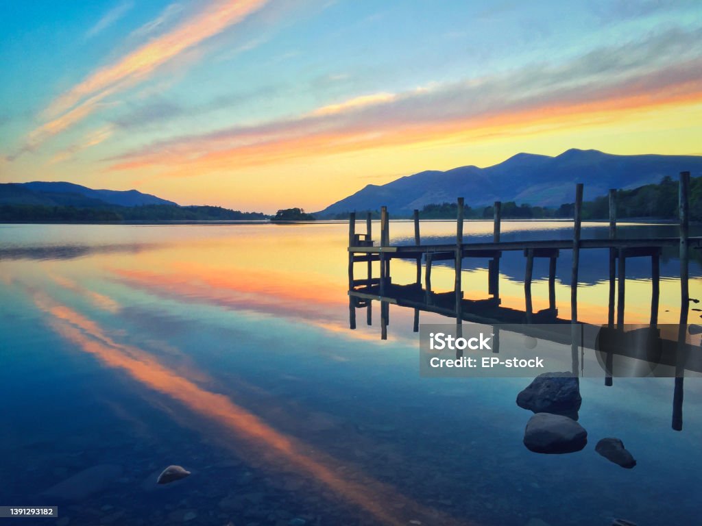 Ashness Landing Jetty at sunrise, Lake District National Park, Cumbria, UK The famous view of Ashnesss Landing Jetty on Derwentwater Cumbria Stock Photo