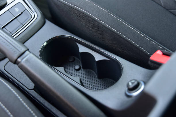 istock Cup holder between the front seats in the car 1391293865