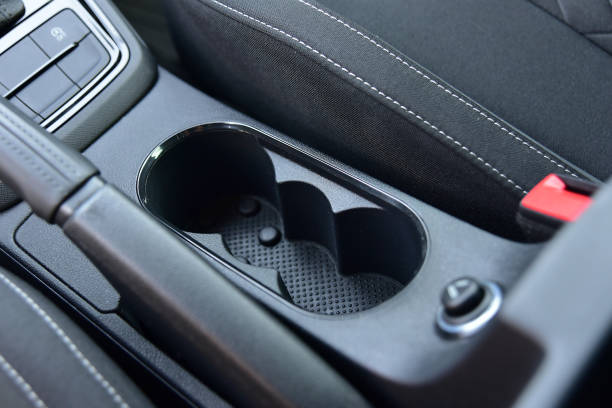 Cup holder between the front seats in the car stock photo