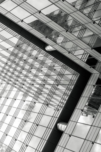 istock Closeup black and white modern office buildings, background with copy space 1391294924