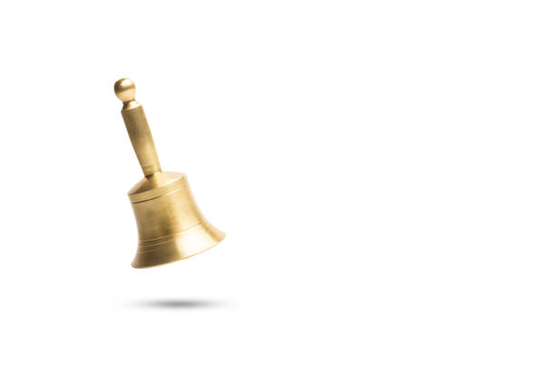 istock A bronze bell floating on a white background with copy space 1391294986
