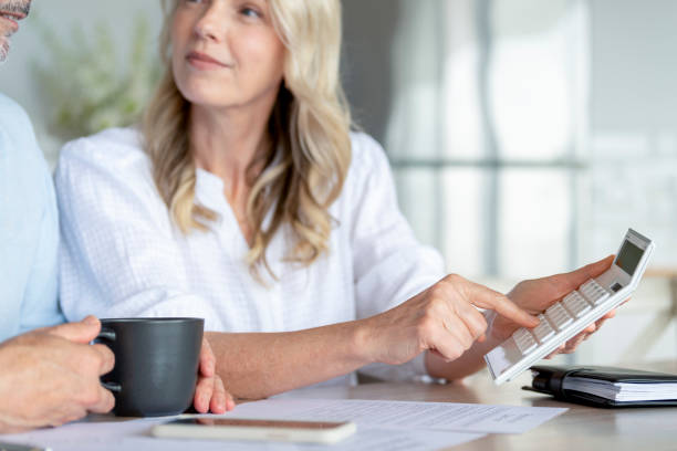 istock Mature Couple working on their home finances. 1391295277