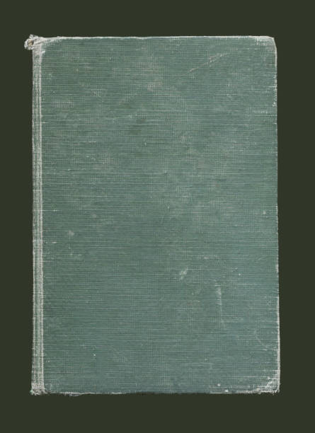 istock Retro book, hardback with stains on dark background 1391297175