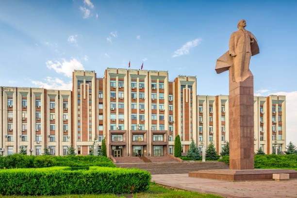 Parliament Building Tiraspol Transnistria Moldova Statue of Lenin (by Nikolai Tomsky, 1970) in front of the Transnistrian Parliament Building in Tiraspol, Transnistria, Moldova on a sunny day. vladimir lenin photos stock pictures, royalty-free photos & images