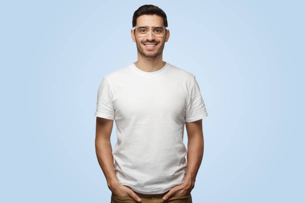 istock Handsome attractive european man smiles standing in hands-in-pockets pose 1391298448