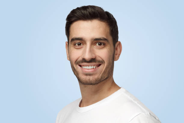 istock Attractive young positive Caucasian man looks confident and happy while smiling 1391298451