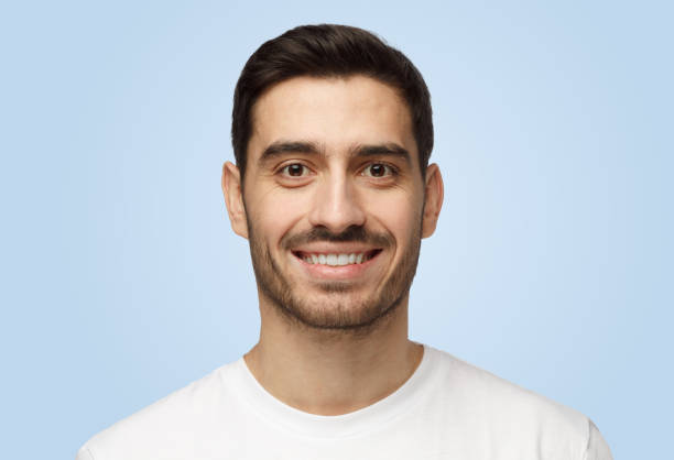 istock Young cheerful attractive good-looking smiling man isolated on grey background 1391298530