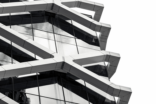 Closeup black and white modern office buildings, background with copy space, full frame horizontal composition