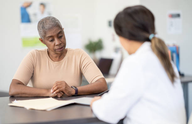 istock Reviewing Treatment with a Cancer Patient 1391303957