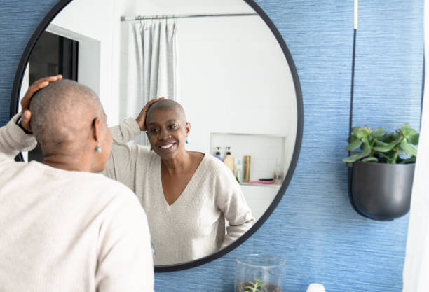 istock Cancer Patient Looking in the Mirror 1391303980